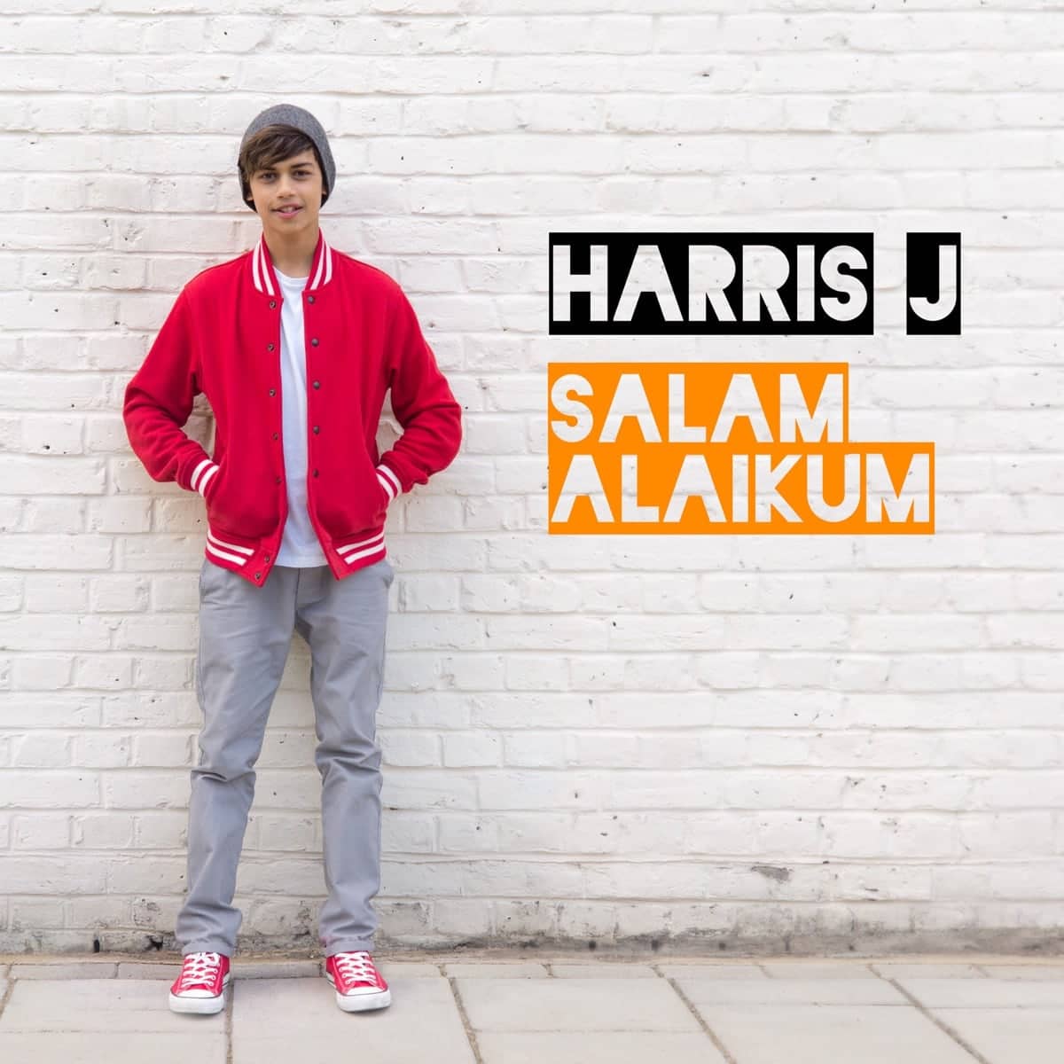 Salam Alaikum single cover: Harris J in a red varsity jacket against a white brick wall